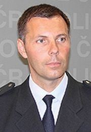 Tomáš Kužel, Johnův kandidát na policejního prezidenta.