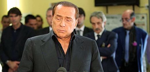 Stále ještě italský premiér Silvio Berlusconi.