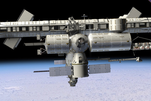 Dragon zakotvil u ISS. Zatím jen v představách ilustrátora.
