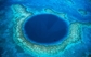 Great Blue Holes, Belize. Tyto díry poseté po dně vod Belize vedou do spleti podvodních jeskyní, v nichž  potápěči prý spatřili nejrozmanitější vodní tvory. (Foto: Telegraph.co.uk) 