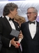 Režisér Alexandr Payne převzal ocenění za Bruce Derna, který vyhrál v kategorii nejlepší mužský herecký výkon. Cenu předal režisér Steven Spielberg (vpravo).