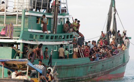 Uprchlíci na lodi.
