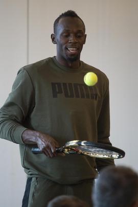 Usaun Bolt na tiskové konferenci.