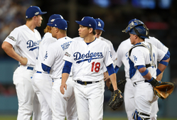 Japonský baseballista Kante Meada z Los Angeles Dodgers (v popředí).