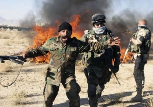 Afghánský voják jásá při ničení droh v priovincii Hílman.