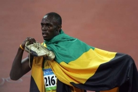 Usain Bolt s jamajskou vlajkou