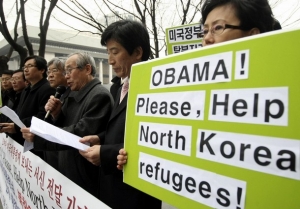 Demonstrace na Jihu Korey: Obamo, pomoz uprchlíkům ze Severu!